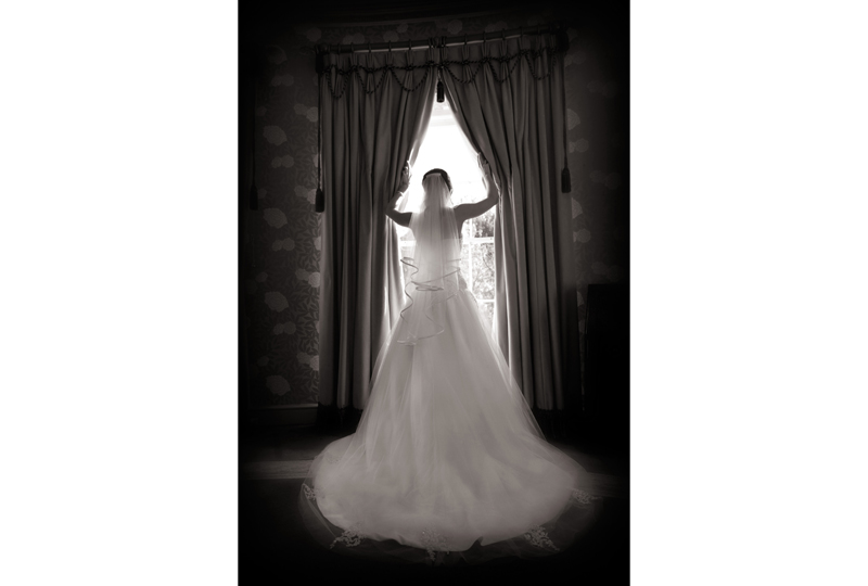 bride opening curtains